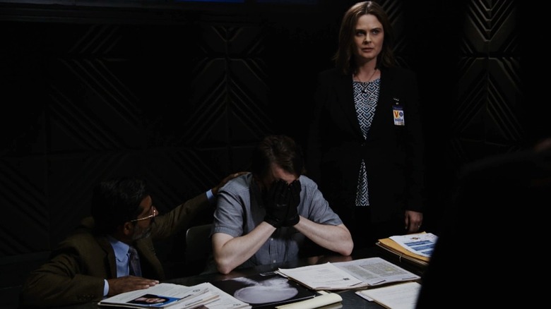Emily Deschanel's Temperance Brennan stands beside Eric Millegan's Zack Addy with his head in his hands in Bones