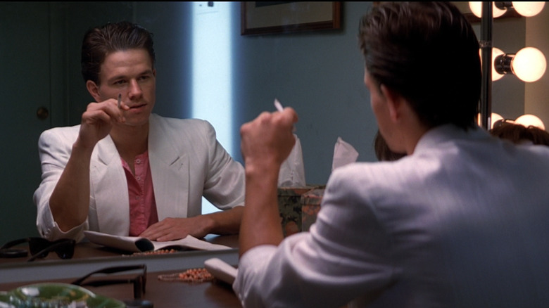 Dirk Diggler (Mark Wahlberg) looks in the mirror 