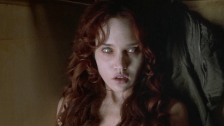 Erica Leerhsen as Erica looking pale with dead eyes in Book of Shadows: Blair Witch 2