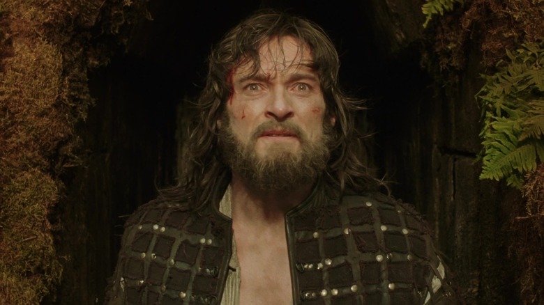 Tomás Creo, bloodied and emerging from a cave, in The Fountain