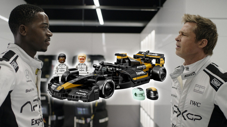 Brad Pitt and Damson Idris as Sonny Hayes and Joshua Pearce in F1 with a LEGO version of their race car between them