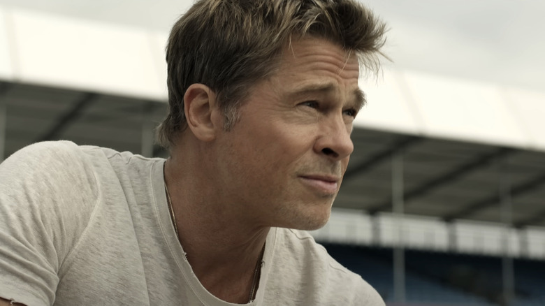 Brad Pitt as Sonny Hayes looks off into the distance in F1