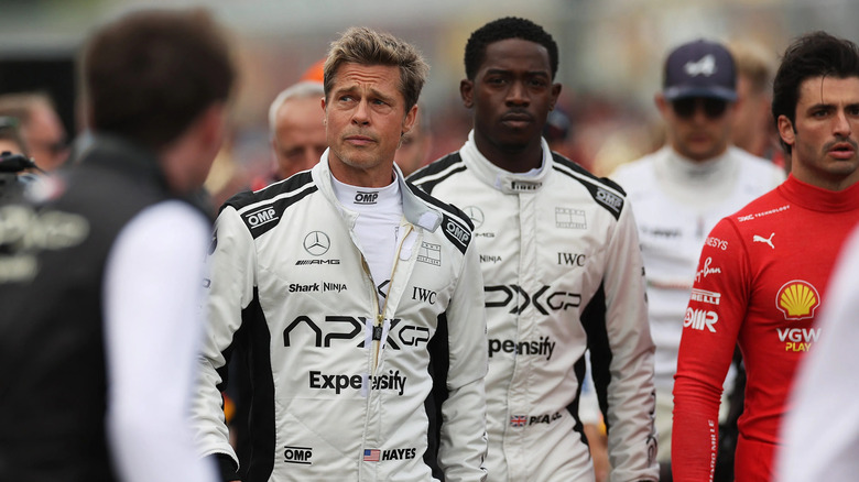 Sonny and Joshua walk amongst the racers in F1