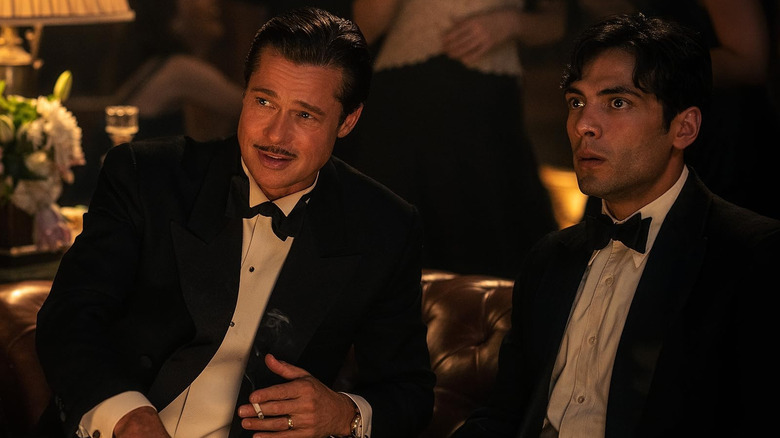 Brad Pitt as Jack Conrad and Diego Calva as Manny Torres wearing tuxedos in Babylon