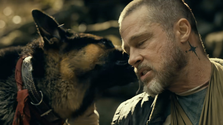 Brad Pitt as James Belmont being comforted by Odin in Heart of the Beast