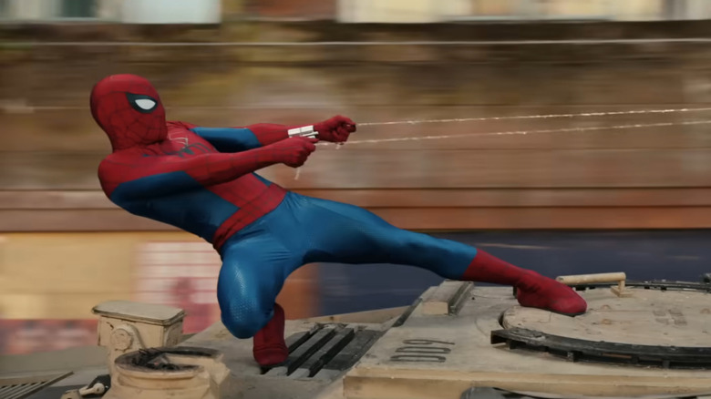 Spider-Man leaning back, hanging on to two strands of webbing in Spider-Man: Brand New Day