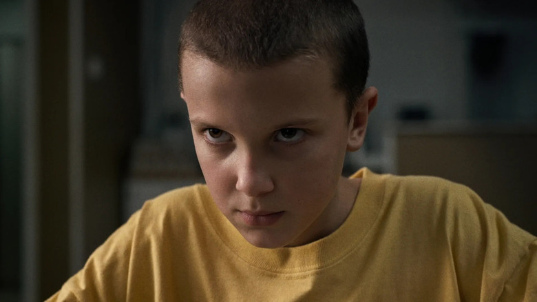 Millie Bobby Brown as Eleven staring intensely in Stranger Things