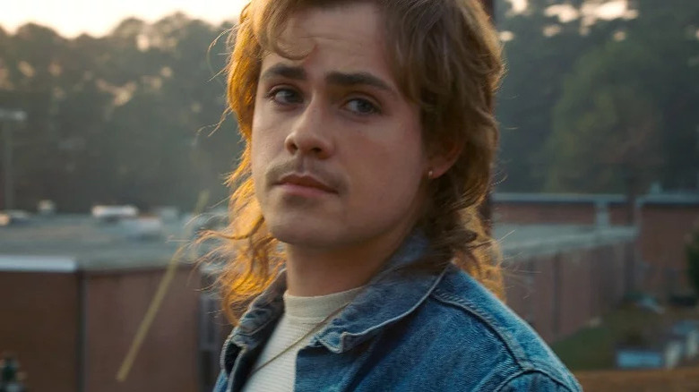 Billy looking angsty in a denim jacket in Stranger Things
