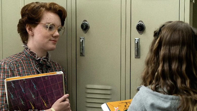 Barb talking to Nancy at their lockers at Hawkins High in Stranger Things