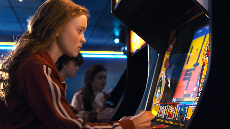 Max playing Dig Dug in the arcade in Stranger Things