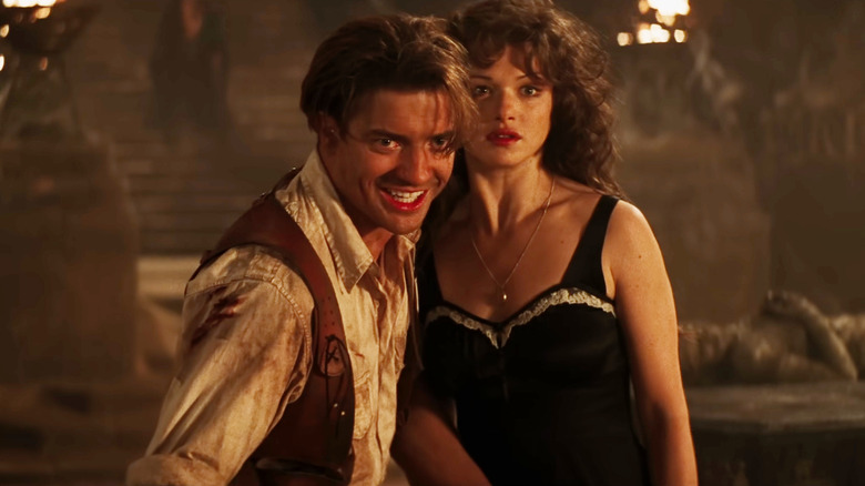 Brendan Fraser as Rick smiling next to Rachel Weisz as Evie in The Mummy (1999)