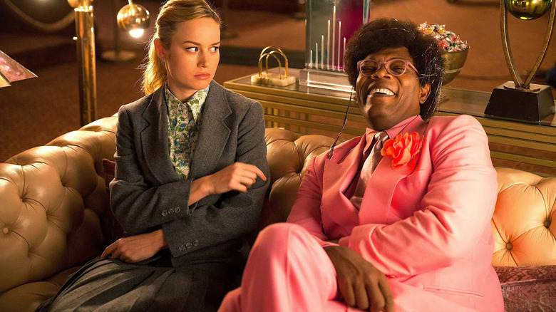 Kit on a couch with the Salesman in Unicorn Store