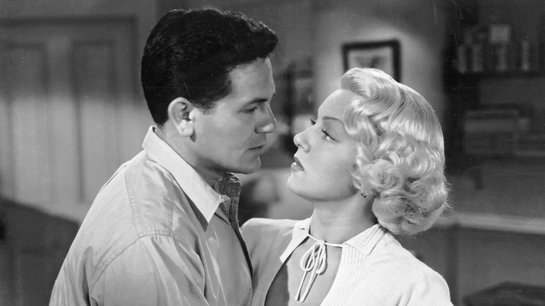 Frank Chambers and Cora Smith looking at one another in The Postman Always Rings Twice
