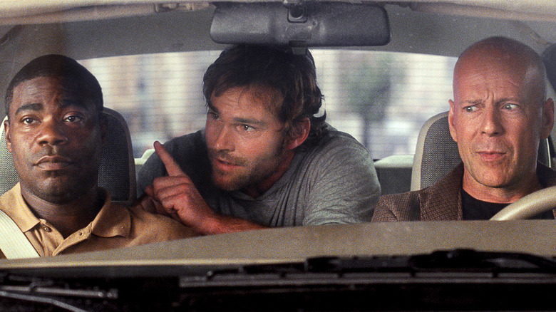 Tracy Morgan's Paul and Bruce Willis' Jimmy being annoyed by Seann William Scott's Dave in Cop Out