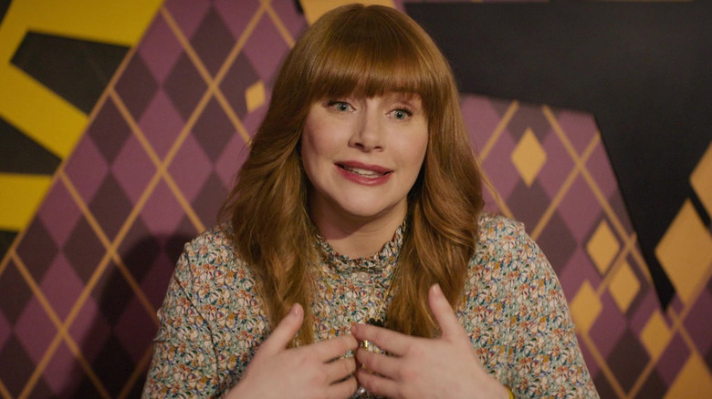Bryce Dallas Howard as Elly Conway speaking to the press in Argylle
