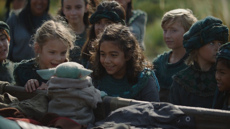 Grogu with the Sorgan villagers in The Mandalorian