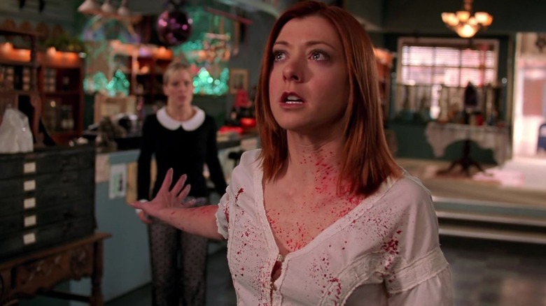 A crying Alyson Hannigan as Willow on Buffy the Vampire Slayer, covered in blood