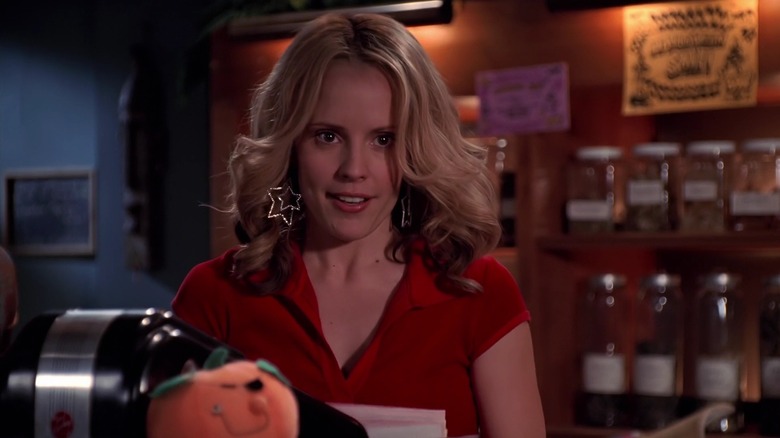 Emma Caulfield Ford as Anya on Buffy the Vampire Slayer, wearing big star-shaped earrings