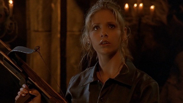 Sarah Michelle Gellar as Buffy on Buffy the Vampire Slayer, holding a crossbow