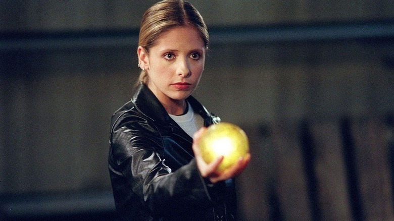 Buffy holding an orb in "Buffy the Vampire Slayer"
