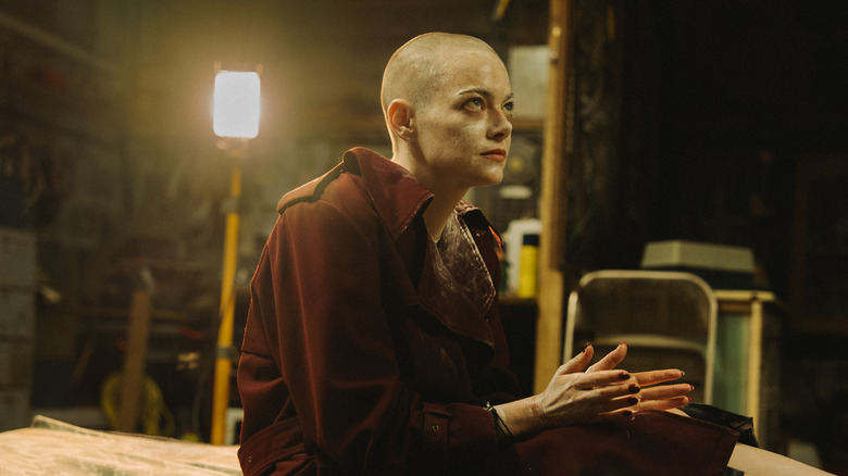 Michelle Fuller, her head shaved, is held captive in a basement in Bugonia