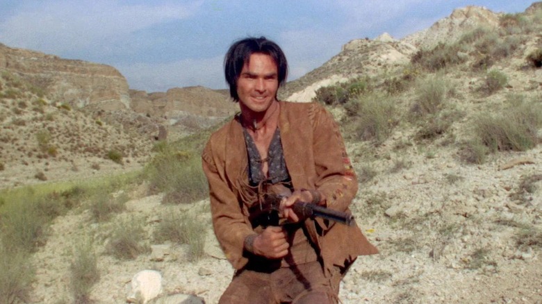 Navajo Joe launches a pistol in the desert in Navajo Joe