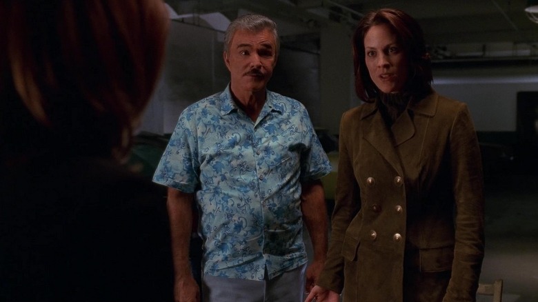 God and Reyes standing next to each other on The X-Files