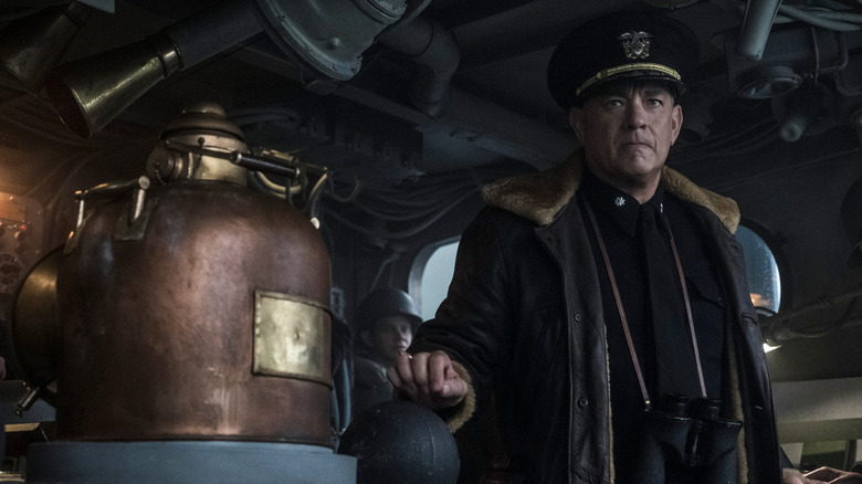 Tom Hanks as Naval Commander Ernie Krause standing on the bridge of his ship in Greyhound
