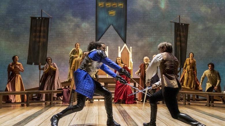 Jordan Donica, Phillipa Soo (background), Andrew Burnap and the company in Lincoln Center Theater's Camelot