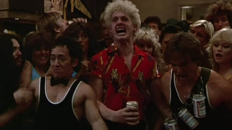 Christopher Penn as Tom Drake prepares to smash through an apartment wall with Ángel Salaza as Bennie and Michael Bowen as Vince in The Wild Life