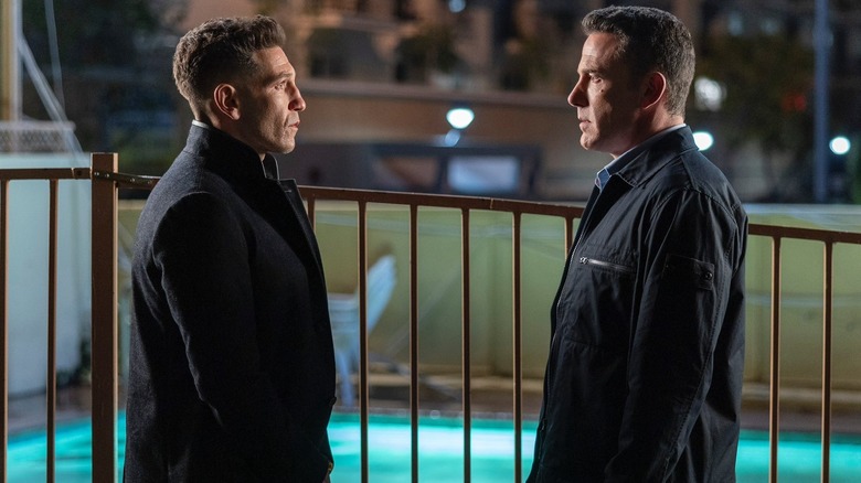 Jon Bernthal's Brax and Ben Affleck's Christian looking at one another face to face in The Accountant 2