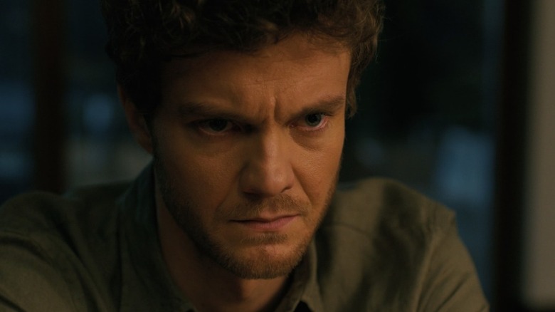 Jack Quaid as Josh sits and looks sternly at the Companion