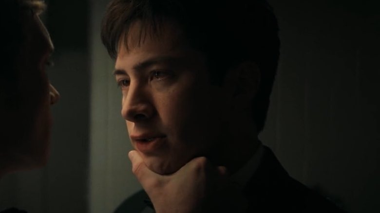 Shane Hollander's face held in Ilya's hand in Heated Rivalry