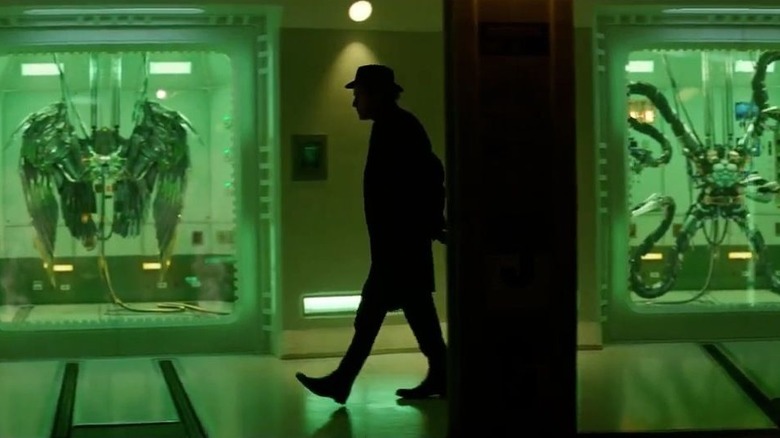 Figure walking by Vulture's wings and Doc Ock's arms in The Amazing Spider-Man 2