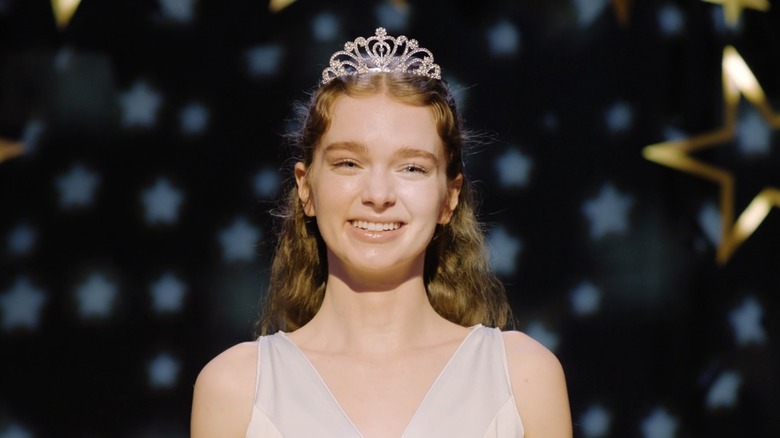 Carrie (2026) - Carrie White smiling on stage as Prom Queen