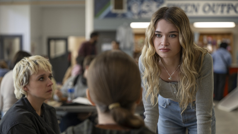 Chris looks at Carrie in the cafeteria in Carrie (2026)