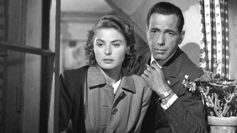 Rick and Ilsa speak to someone offscreen in Casablanca