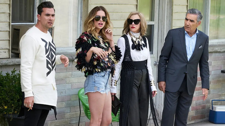 David Alexis Moira and Johnny looking horrified outside of the motel on Schitt's Creek