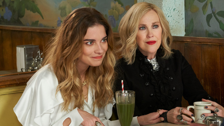 Alexis and Moira sitting at the diner in Schitt's Creek
