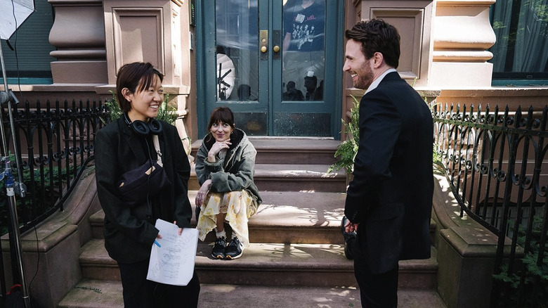 Celine Song, Dakota Johnson, and Chris Evans on the set of Materialists