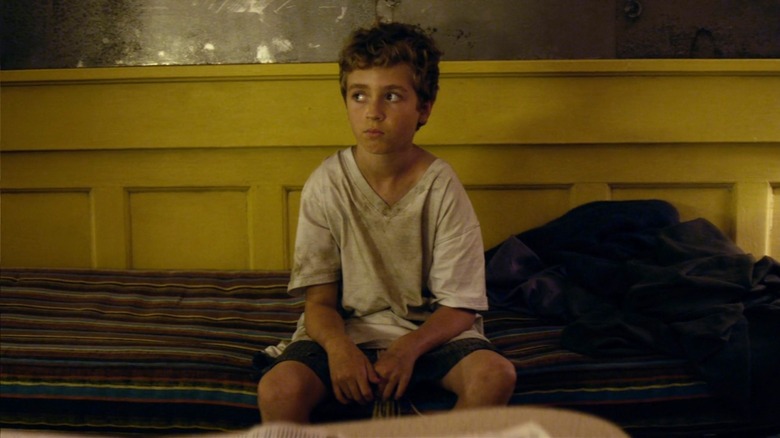 Tim sitting on bed in Chained