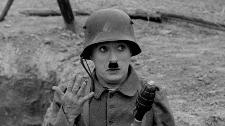 A beleaguered barber, fighting in the trenches of the Great War in The Great Dictator