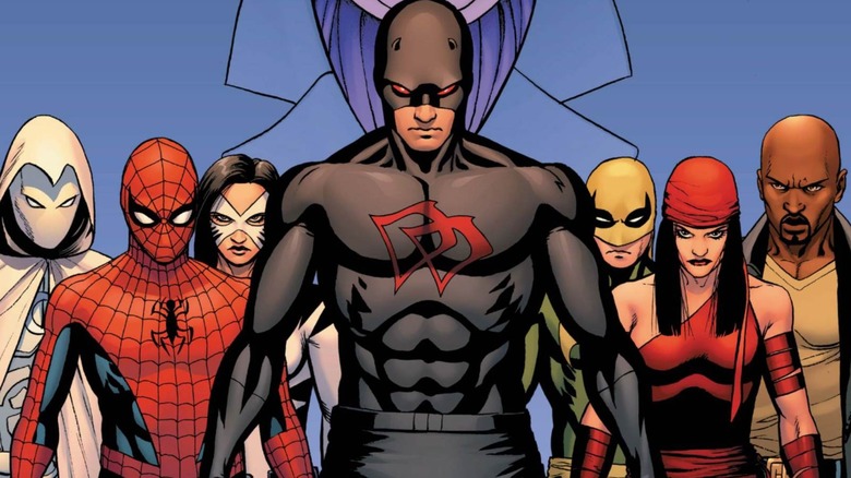 Daredevil in a black suit stood in front of Marvel heroes