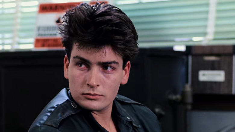 Charlie Sheen in Ferris Bueller's Day Off, with bleary eyes and a black leather jacket