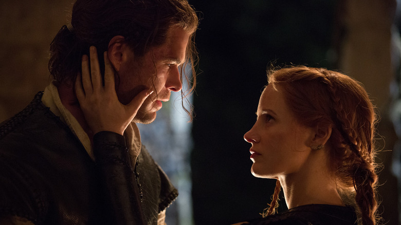 Jessica Chastain as Sara holding the face of Chris Hemsworth as Eric in The Huntsman: Winter's War