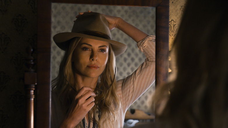 Charlize Theron dons a cowboy hat as Anna Barnes-Leatherwood in A Million Ways to Die in the West
