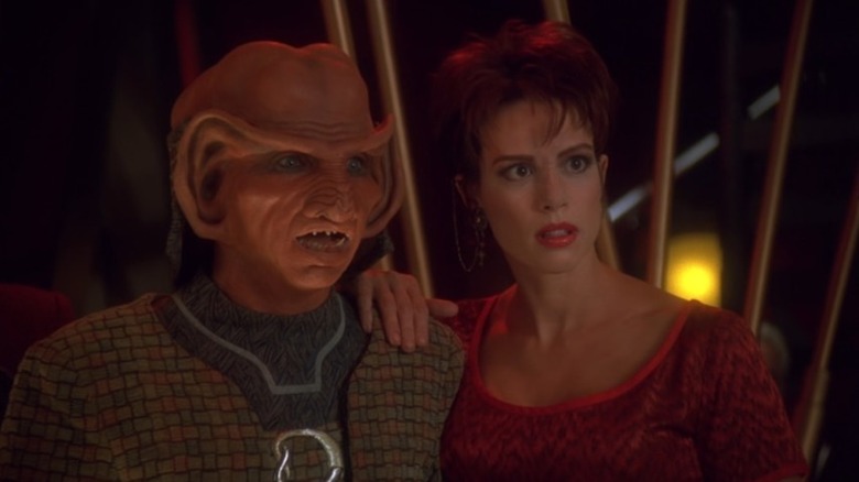 Rom and Leeta are asonished. Leeta has her hand on Rom's shoulder. From Star Trek: Deep Space Nine.