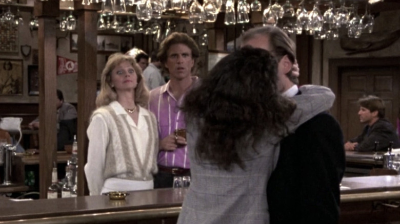 Shelley Long as Diane Chambers and Ted Danson as Sam Malone looking shocked as Bebe Neuwirth as Lilith Sternin kisses Kelsey Grammer as Frasier Crane in Cheers