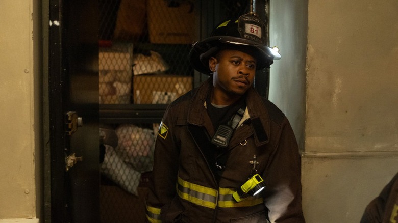 Daniel Kyri as Darren Ritter in his fire gear in front of a storage room on Chicago Fire