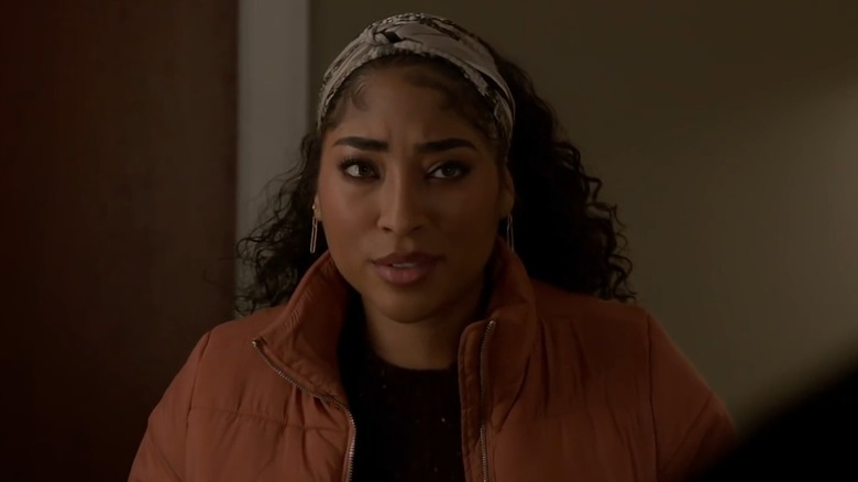 Adriyan Rae as Gianna Mackey in a casual jacket showing up at Gallo's door on Chicago Fire